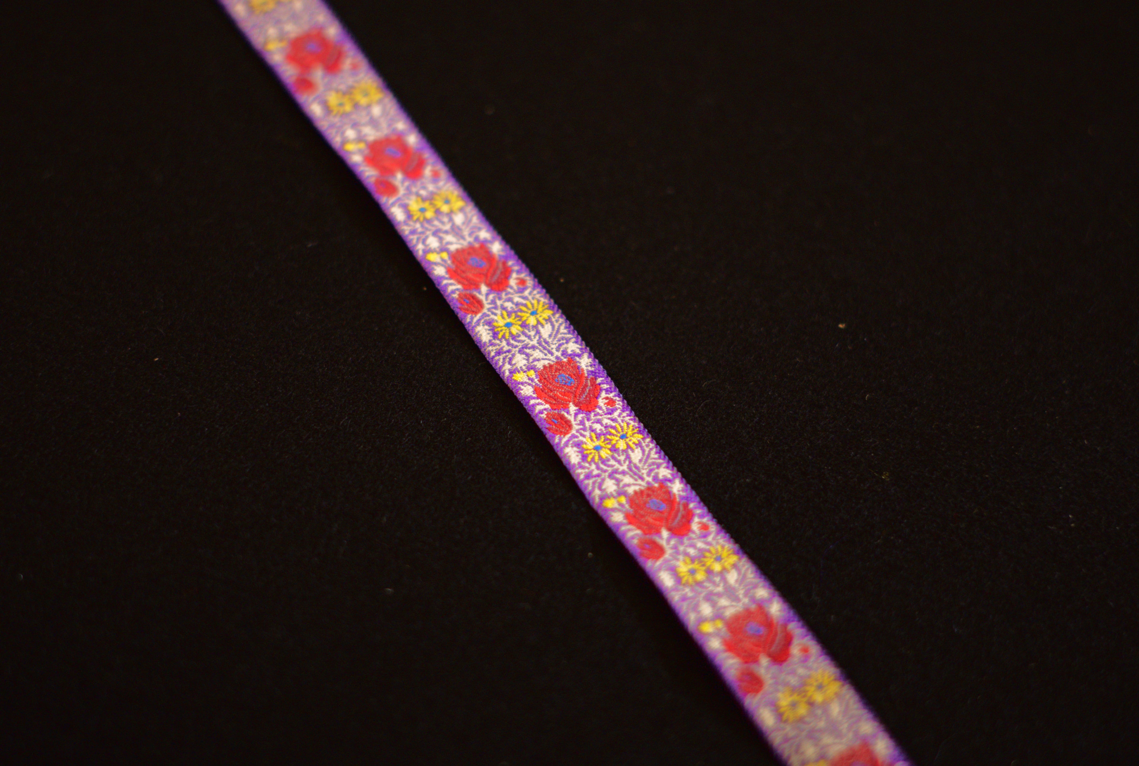 Passamaneria Broccato fondo viola (h.1.3cm)